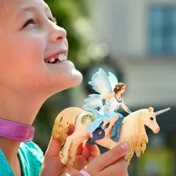 Eyela Riding On Golden Unicorn